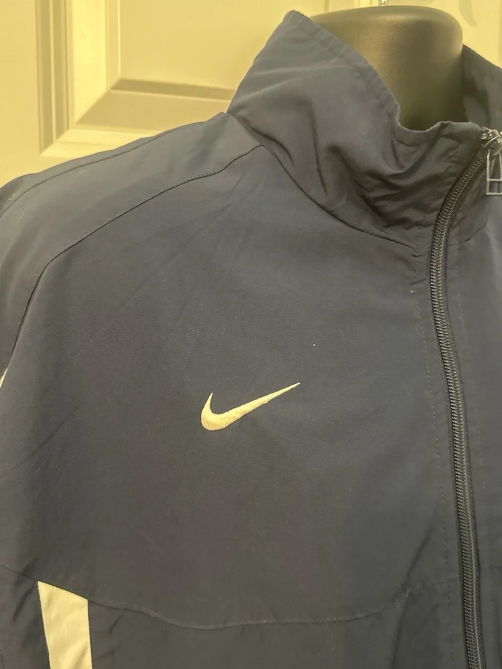 Vintage 1990’s Nike Men’s Navy Track Jacket with White Accents